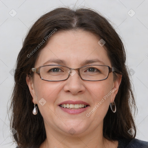 Joyful white adult female with medium  brown hair and grey eyes