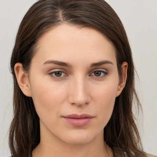 Neutral white young-adult female with long  brown hair and brown eyes