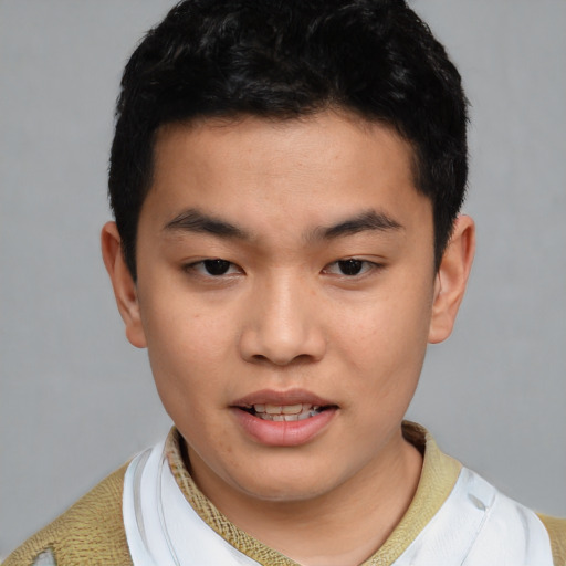 Joyful asian young-adult male with short  black hair and brown eyes