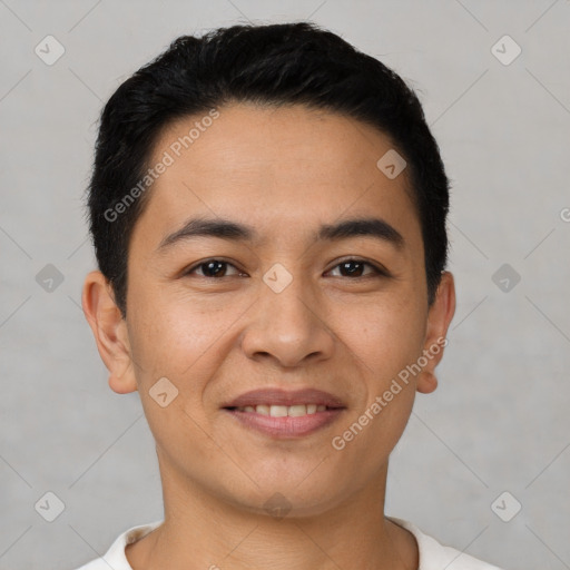 Joyful latino young-adult male with short  black hair and brown eyes