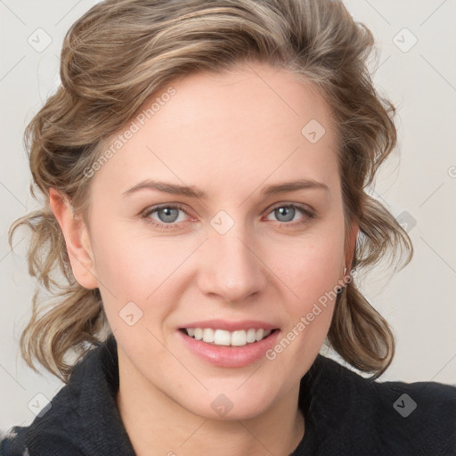 Joyful white young-adult female with medium  brown hair and blue eyes