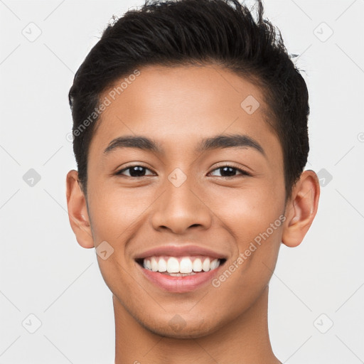 Joyful latino young-adult male with short  brown hair and brown eyes