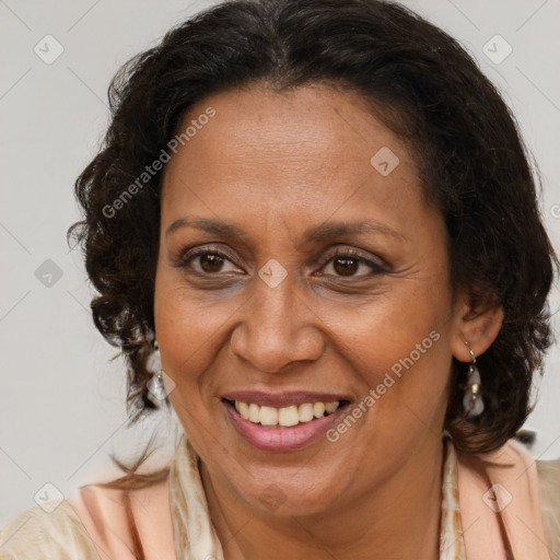 Joyful black adult female with medium  brown hair and brown eyes