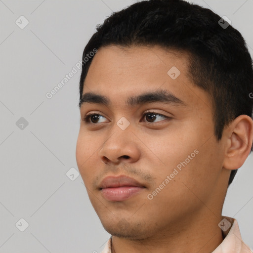 Neutral latino young-adult male with short  black hair and brown eyes