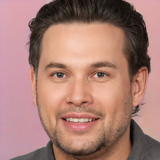 Joyful white young-adult male with short  brown hair and brown eyes