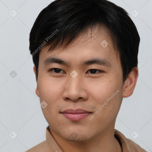 Joyful asian young-adult male with short  black hair and brown eyes