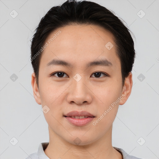 Joyful asian young-adult male with short  brown hair and brown eyes