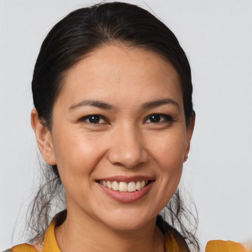 Joyful white young-adult female with medium  brown hair and brown eyes