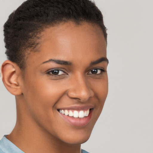 Joyful latino young-adult female with short  brown hair and brown eyes