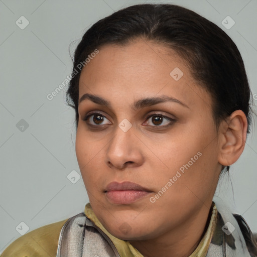 Joyful latino young-adult female with medium  brown hair and brown eyes