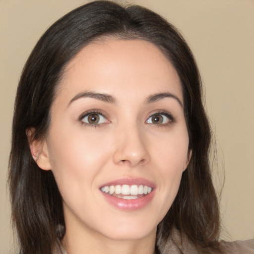 Joyful white young-adult female with medium  brown hair and brown eyes