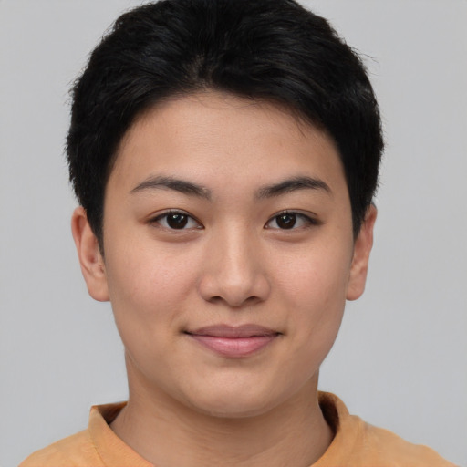 Joyful asian young-adult female with short  black hair and brown eyes
