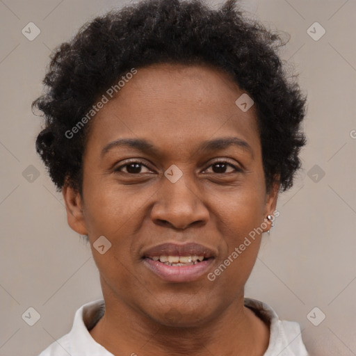 Joyful black adult female with short  brown hair and brown eyes