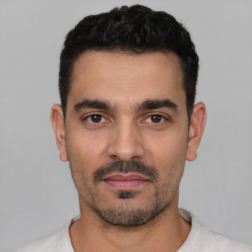 Neutral white young-adult male with short  black hair and brown eyes
