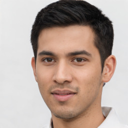 Joyful asian young-adult male with short  brown hair and brown eyes