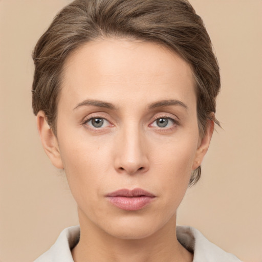 Neutral white young-adult female with short  brown hair and brown eyes