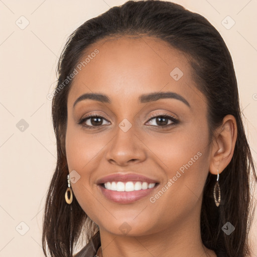 Joyful white young-adult female with long  brown hair and brown eyes