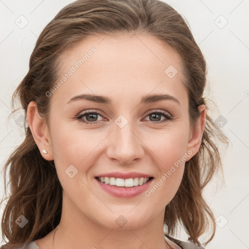 Joyful white young-adult female with medium  brown hair and blue eyes