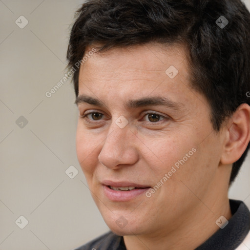 Joyful white adult male with short  brown hair and brown eyes