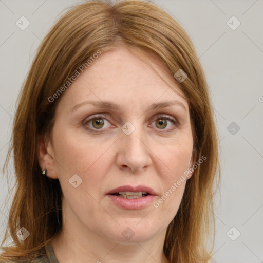 Joyful white adult female with medium  brown hair and blue eyes