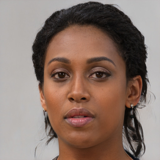 Neutral black young-adult female with long  black hair and brown eyes