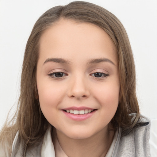 Joyful white child female with medium  brown hair and brown eyes