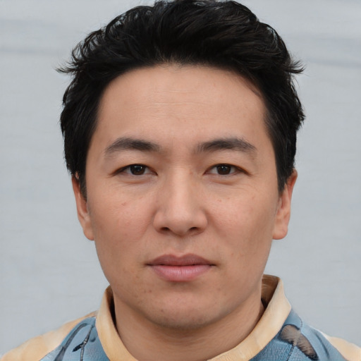 Neutral white young-adult male with short  black hair and brown eyes