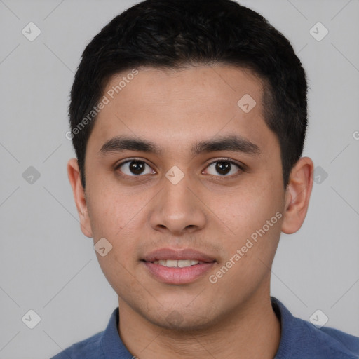 Joyful asian young-adult male with short  black hair and brown eyes