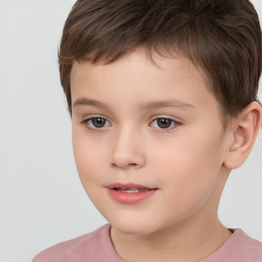 Joyful white child male with short  brown hair and brown eyes