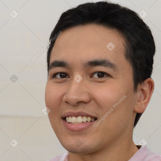 Joyful white young-adult male with short  black hair and brown eyes