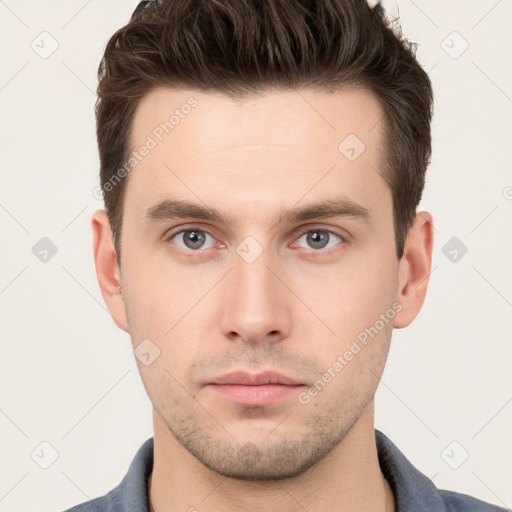 Neutral white young-adult male with short  brown hair and brown eyes