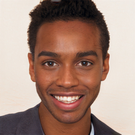 Joyful black young-adult male with short  brown hair and brown eyes