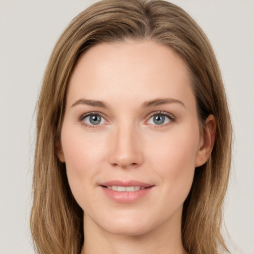 Joyful white young-adult female with long  brown hair and green eyes