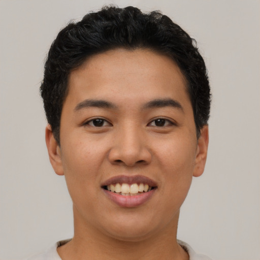 Joyful asian young-adult female with short  black hair and brown eyes