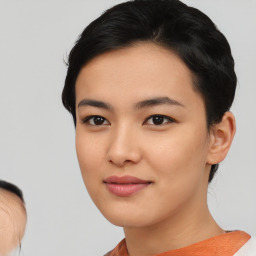 Joyful asian young-adult female with medium  black hair and brown eyes