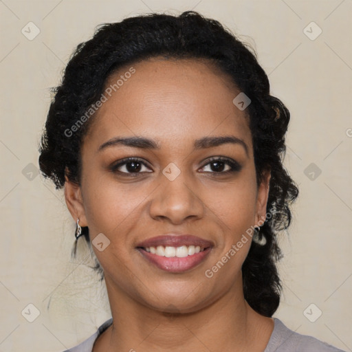 Joyful black young-adult female with long  black hair and brown eyes