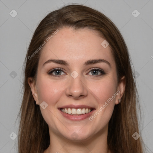 Joyful white young-adult female with long  brown hair and grey eyes