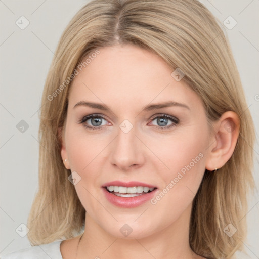 Joyful white young-adult female with long  brown hair and blue eyes