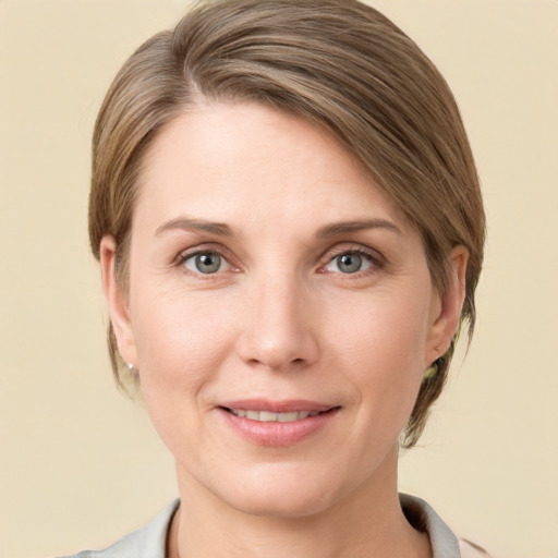 Joyful white young-adult female with medium  brown hair and grey eyes