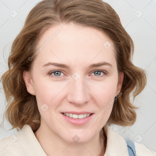 Joyful white young-adult female with medium  brown hair and blue eyes