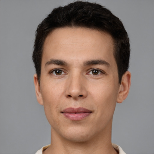 Joyful white young-adult male with short  brown hair and brown eyes