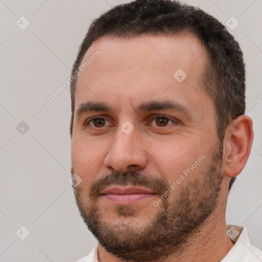 Joyful white adult male with short  brown hair and brown eyes