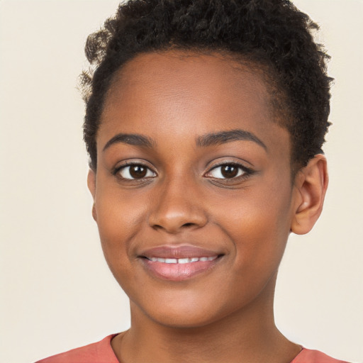 Joyful black young-adult female with short  brown hair and brown eyes