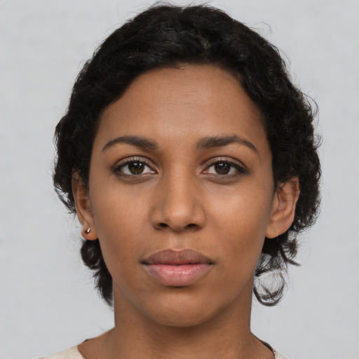 Neutral latino young-adult female with medium  black hair and brown eyes