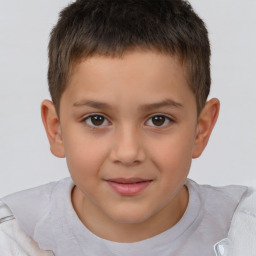 Joyful white child male with short  brown hair and brown eyes