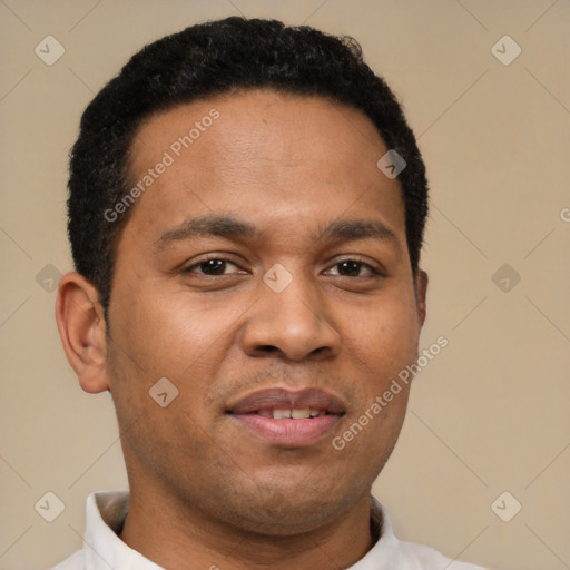 Joyful latino young-adult male with short  brown hair and brown eyes