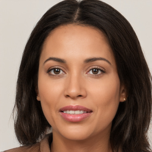 Joyful white young-adult female with long  brown hair and brown eyes