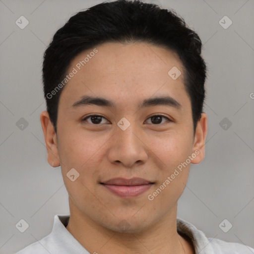 Joyful latino young-adult male with short  brown hair and brown eyes