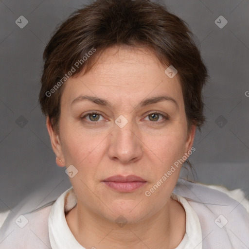 Joyful white adult female with short  brown hair and brown eyes