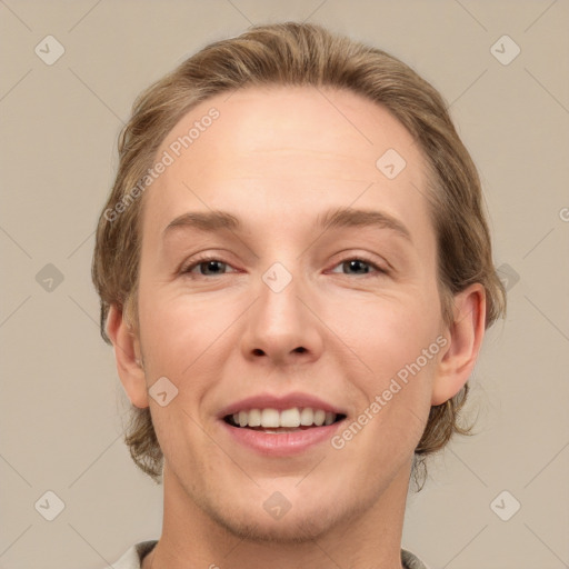 Joyful white adult female with medium  brown hair and green eyes